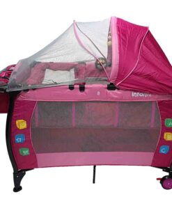 a pink baby crib with a net